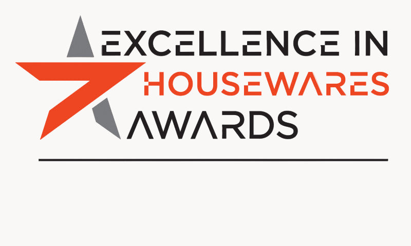 Logo for Excellence in Housewares Awards with a red and gray star design on a white background.